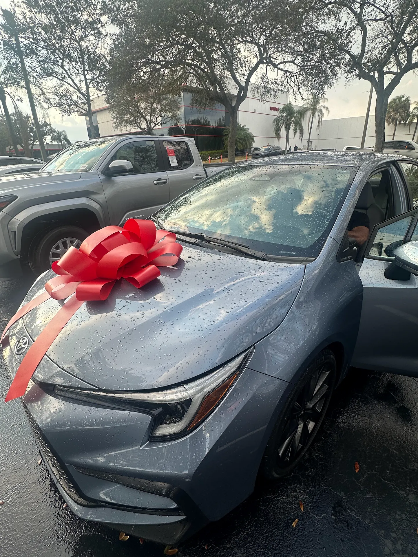 Daytime vehicle delivery with happy buyer