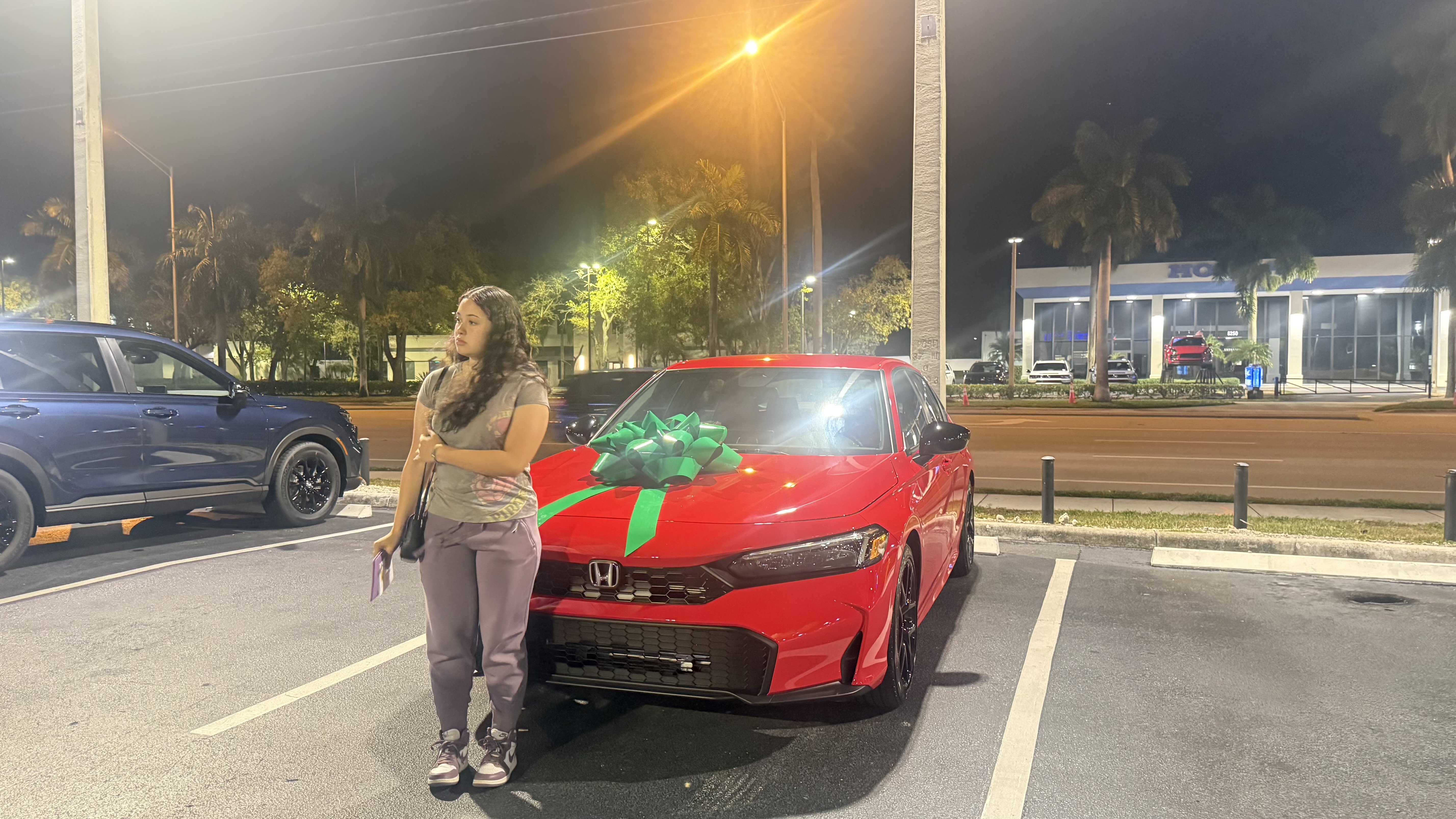 Happy customer celebrating a vehicle purchase